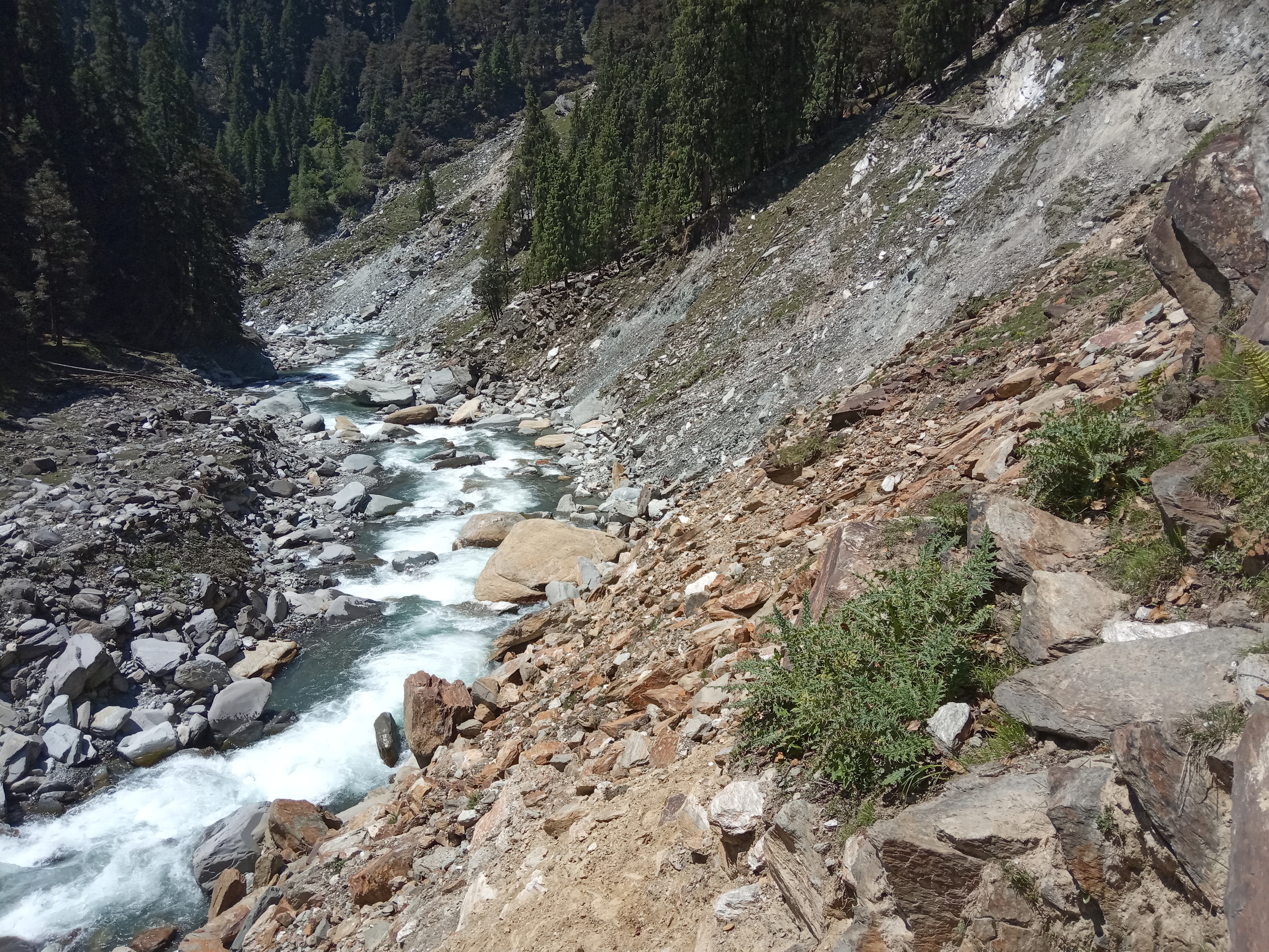 Uhl river with a rocky bank and hills on both side
